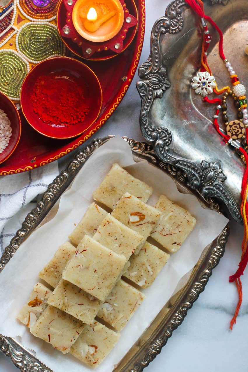 badam burfi in a silver tray