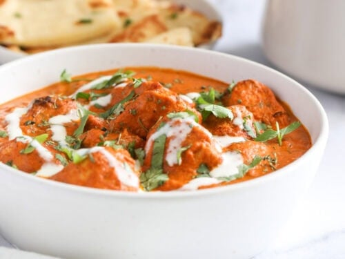 chicken tikka masala in a white bowl