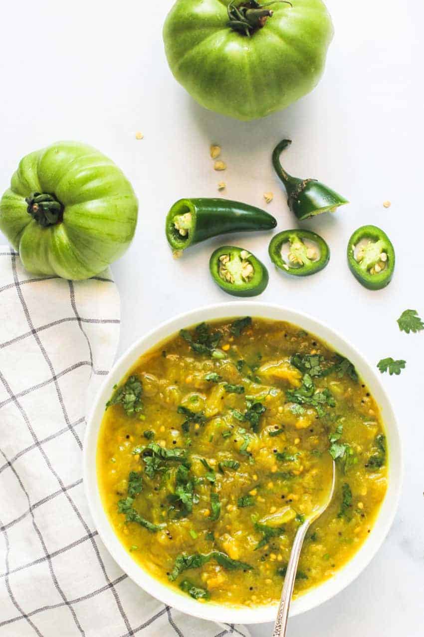 green tomato chutney in a white bowl