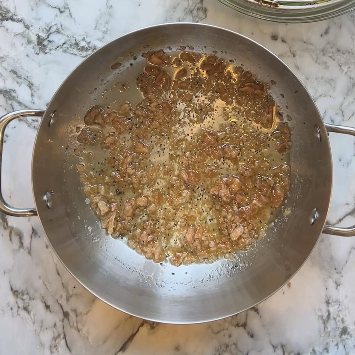 Jaggery added to oil and mustard seeds.