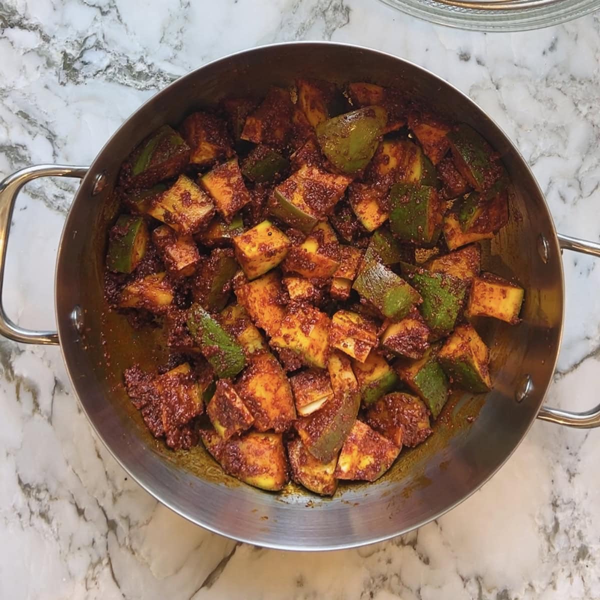 mango pieces mixed in pickle masala