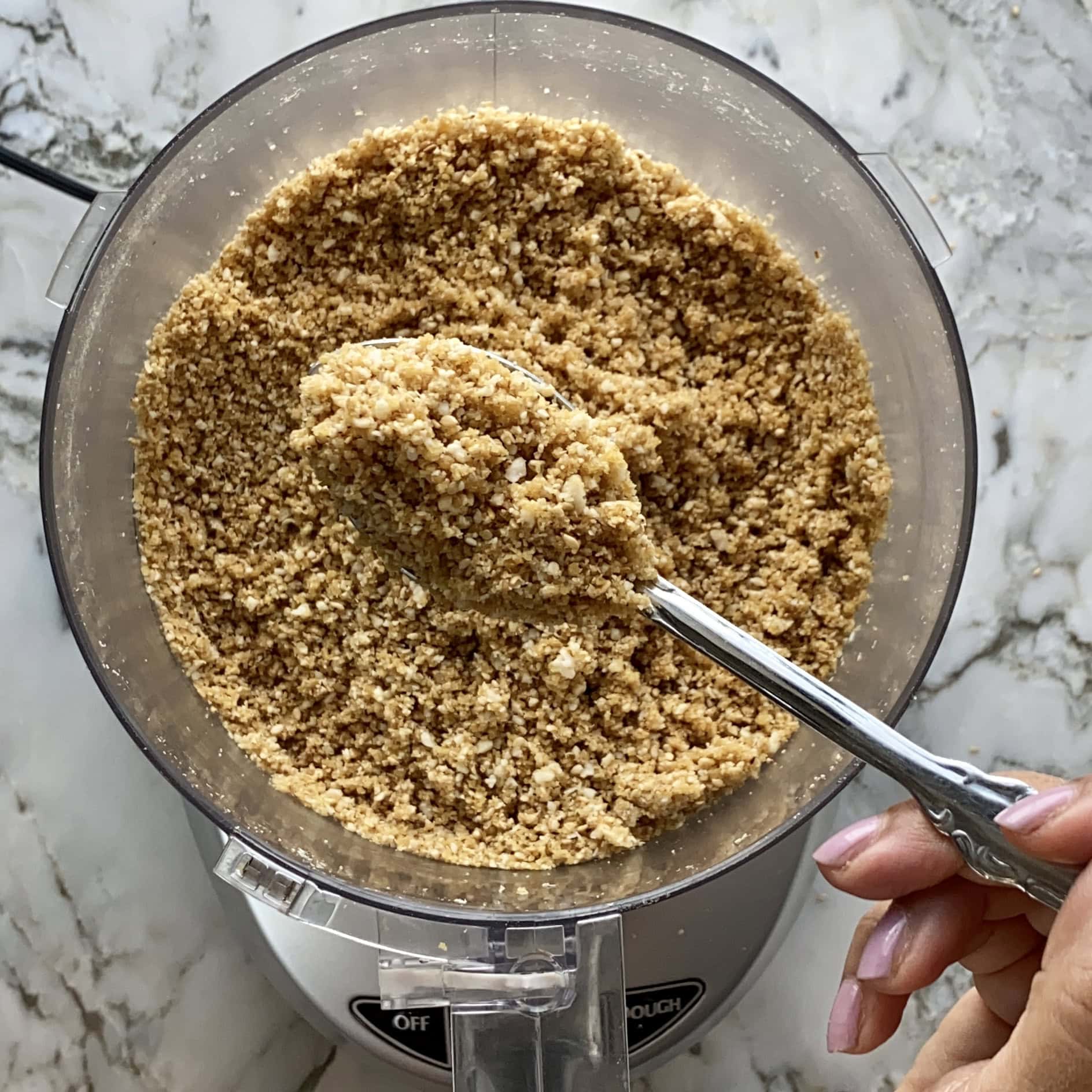 photo showing texture of the mixture for sesame laddu.
