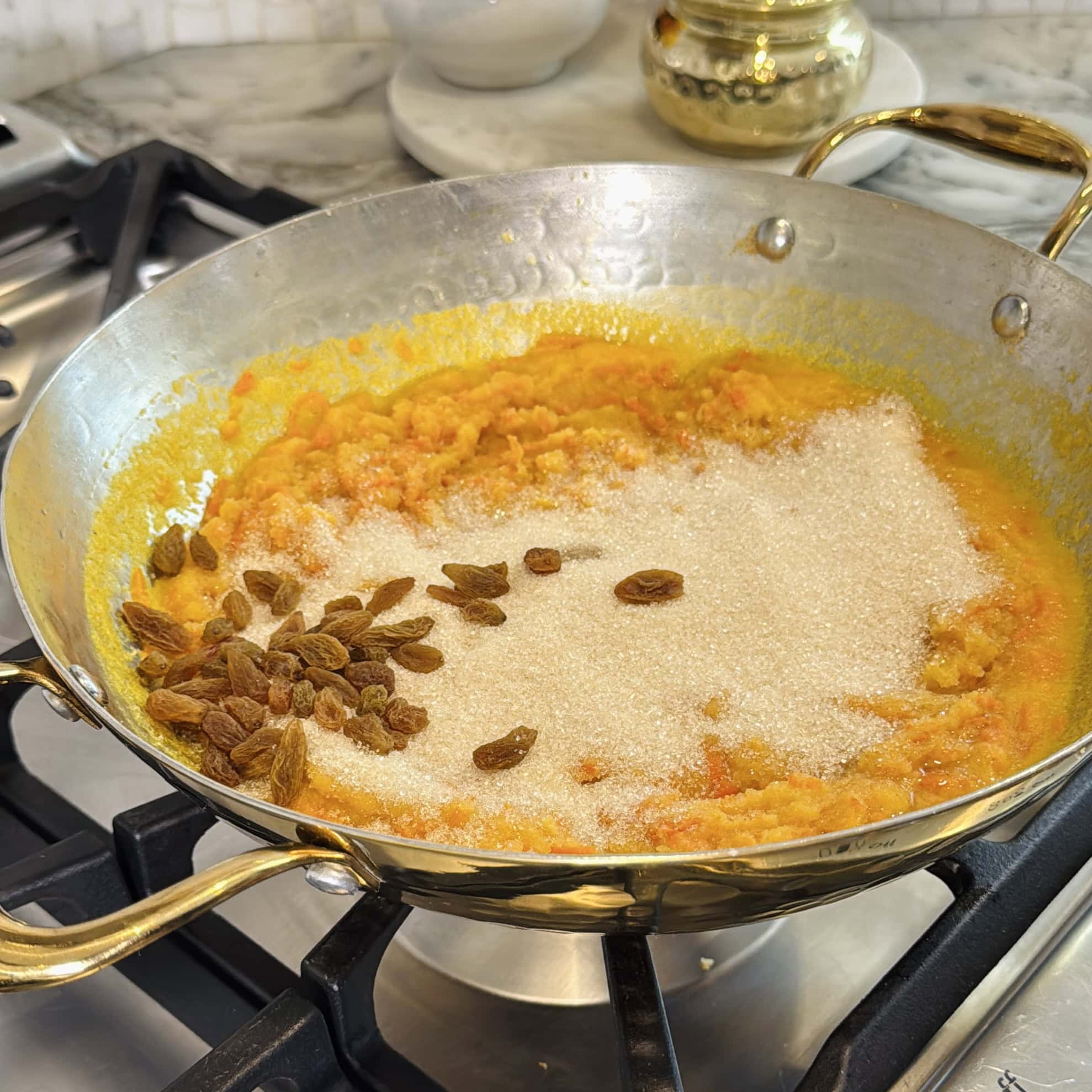 sugar and raisins added to the pan.
