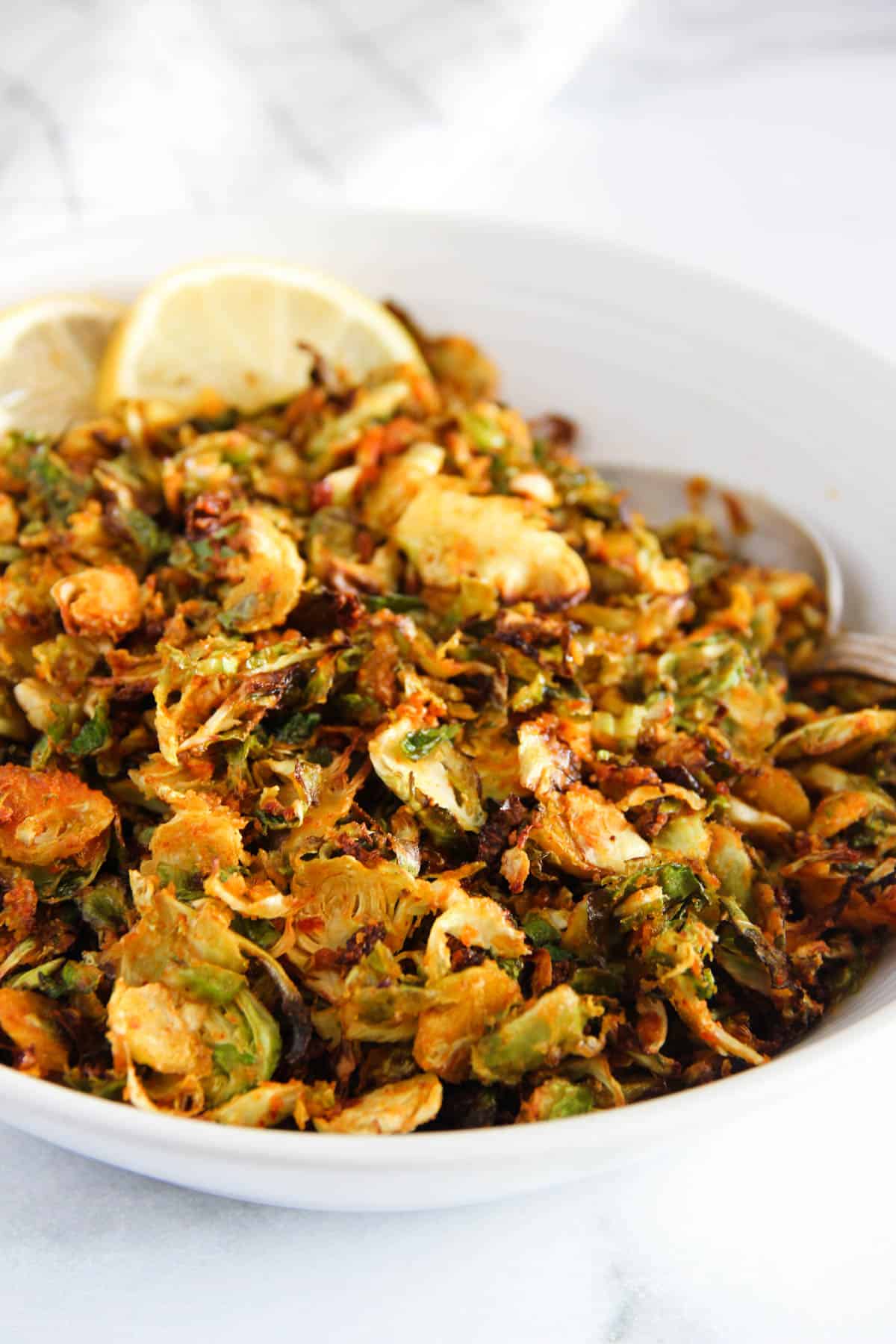 crispy Brussels sprouts in a white bowl 