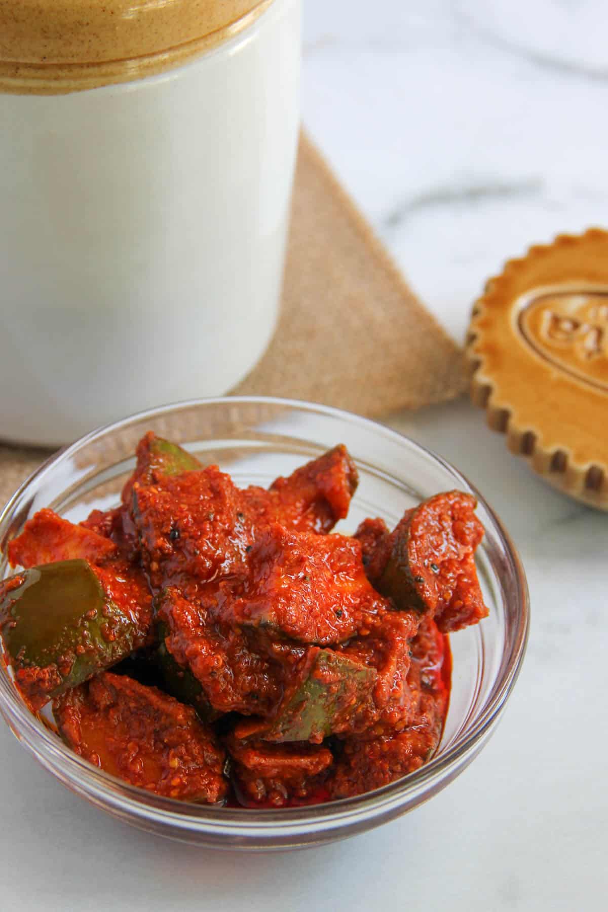 mango pickle in a glass serving bowl 