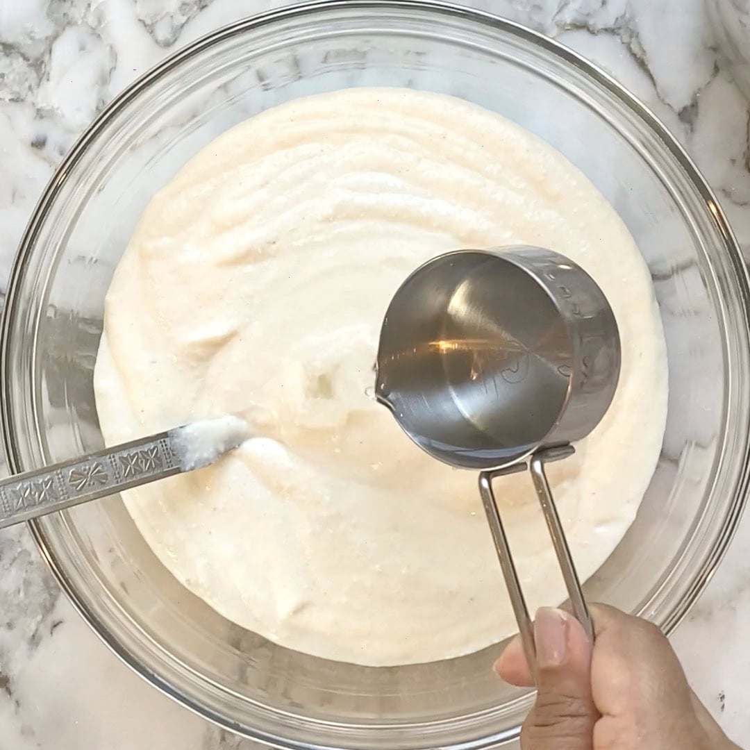 adding water to uttapam batter to make it flowy