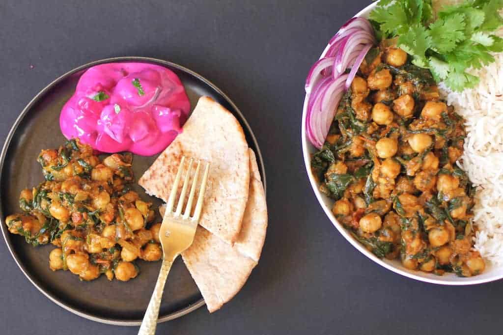 chana saag served with pita bread and raita