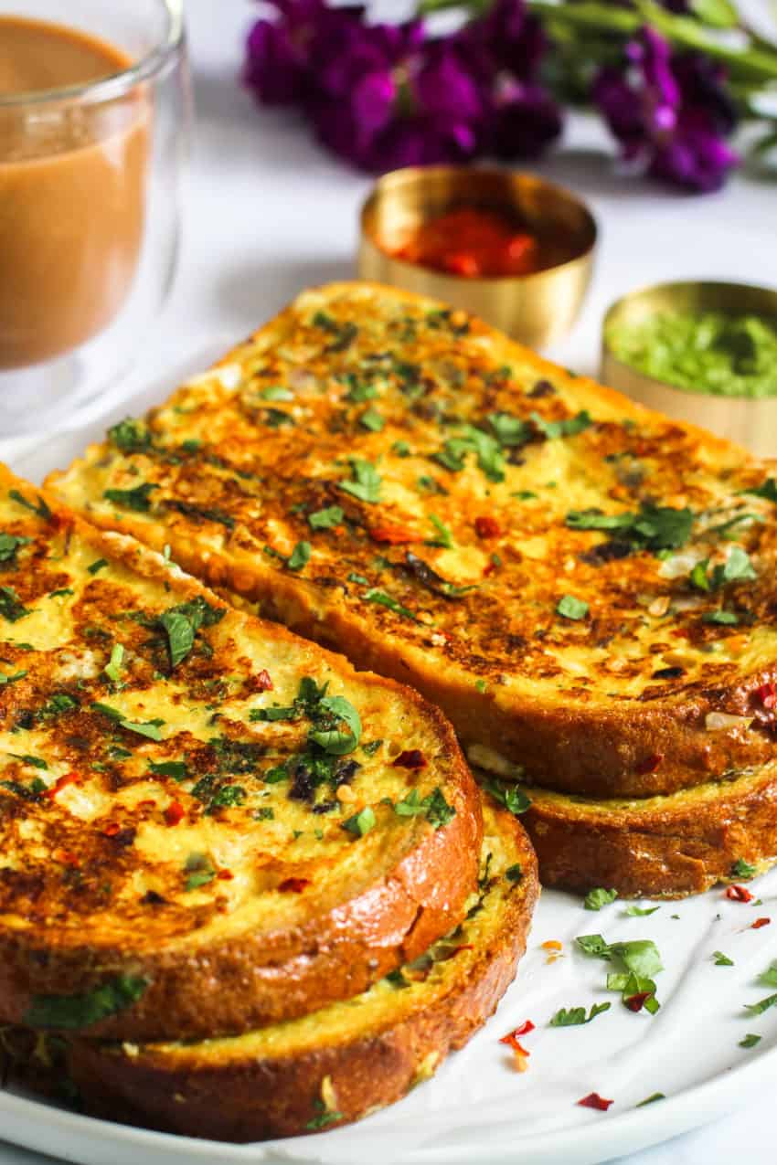 Masala toast served with chutney, ketchup & chai