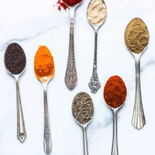 spices displayed in spoons