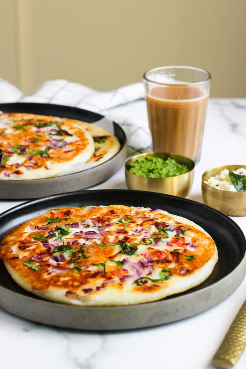 Uttapam served with chutneys and masala chai